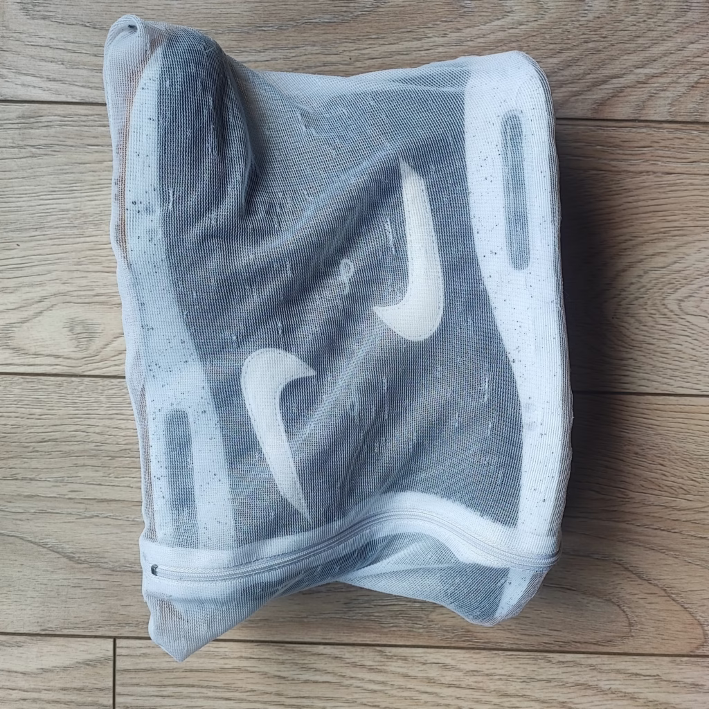 Nike Air Max shoes in a laundry bag.