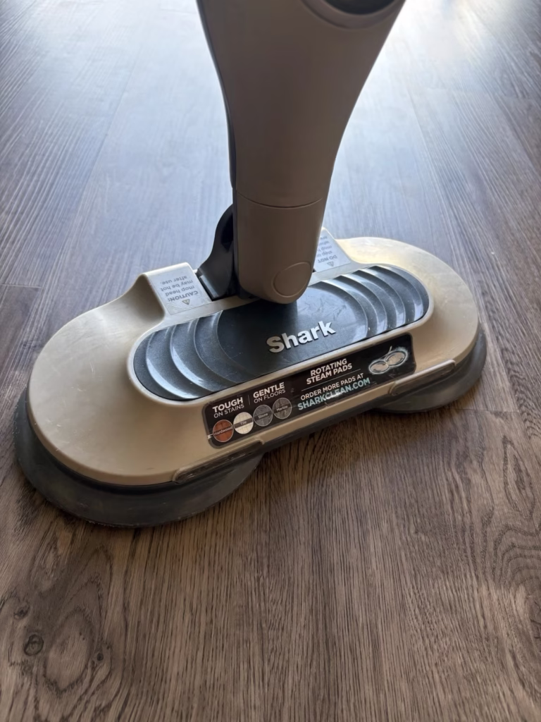 Shark steam mop nozzle on the ground. The Shark logo clearly visible